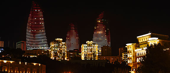 Witness the Flame Towers at Night